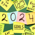 Sticky Notes with Different Goals for 2024 on Green Background Sticky Notes With Different Goals For 2024 On Green Background