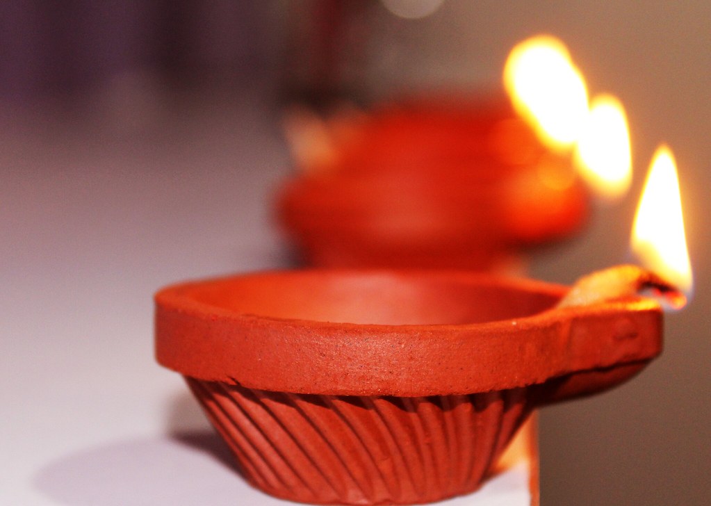 Handmade clay diya oil lamps used to light row after row during Diwali